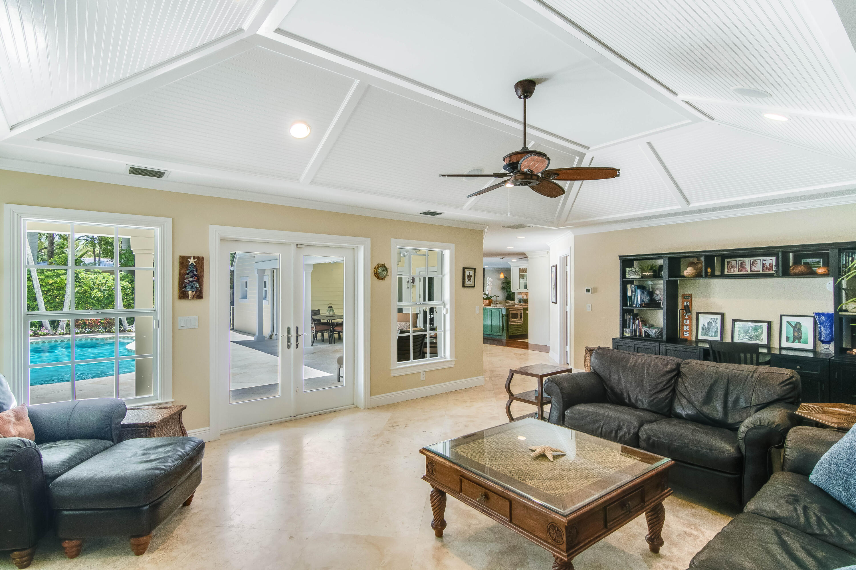 936 Dolphin Drive Jupiter, FL 33458 - Photo 25 of 72 a living room with furniture a ceiling fan and a window