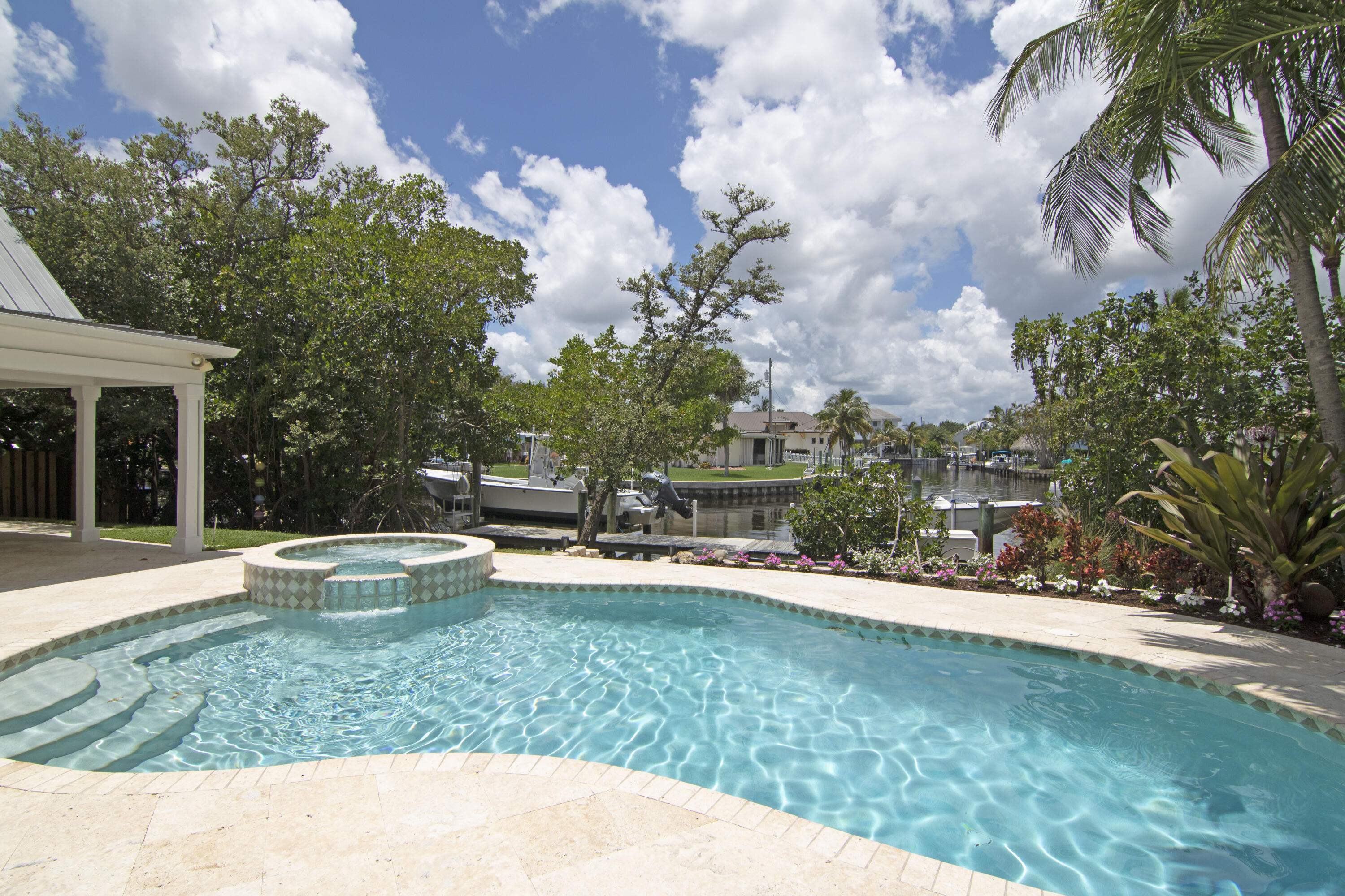 936 Dolphin Drive Jupiter, FL 33458 - Photo 51 of 72 a view of a house with a yard and sitting area