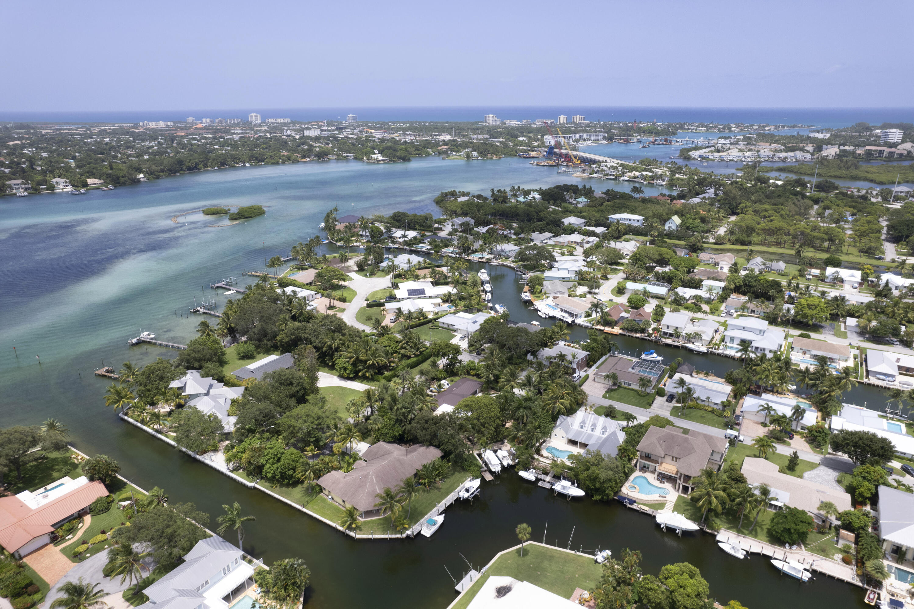 936 Dolphin Drive Jupiter, FL 33458 - Photo 63 of 72 an aerial view of lake and residential houses with outdoor space