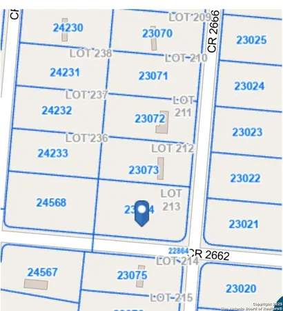 a view of a road with a big yard