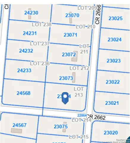 a view of a road with a big yard