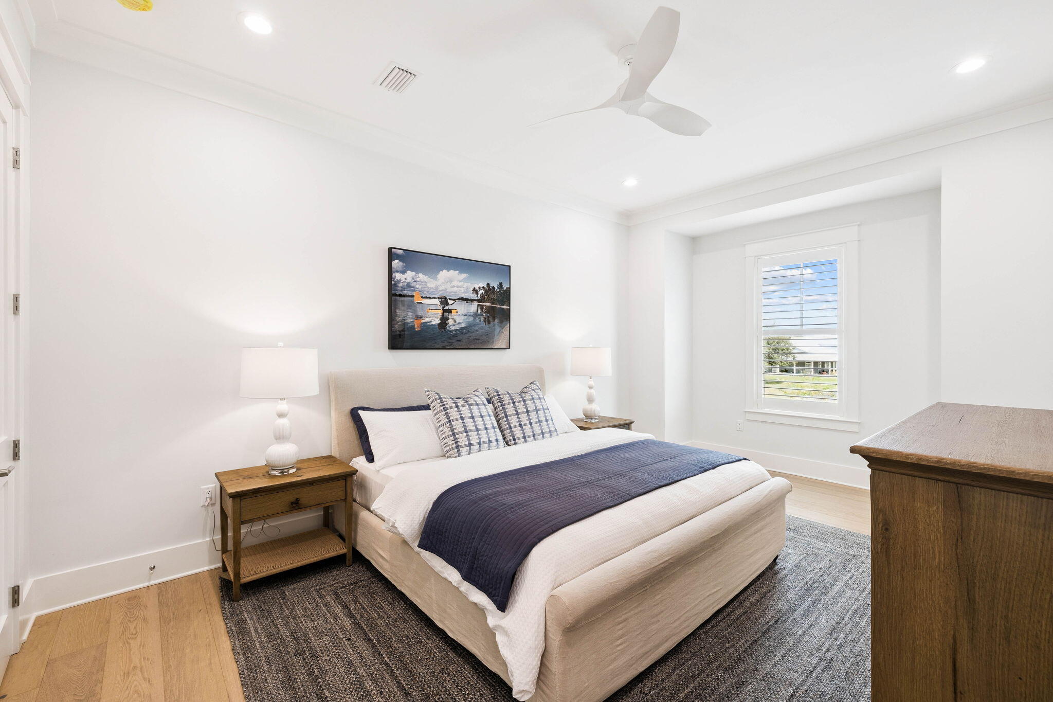 45 Grove Townhomes Place, Unit 105 Santa Rosa Beach, FL 32459 - Photo 17 of 36 a bedroom with a bed and a table