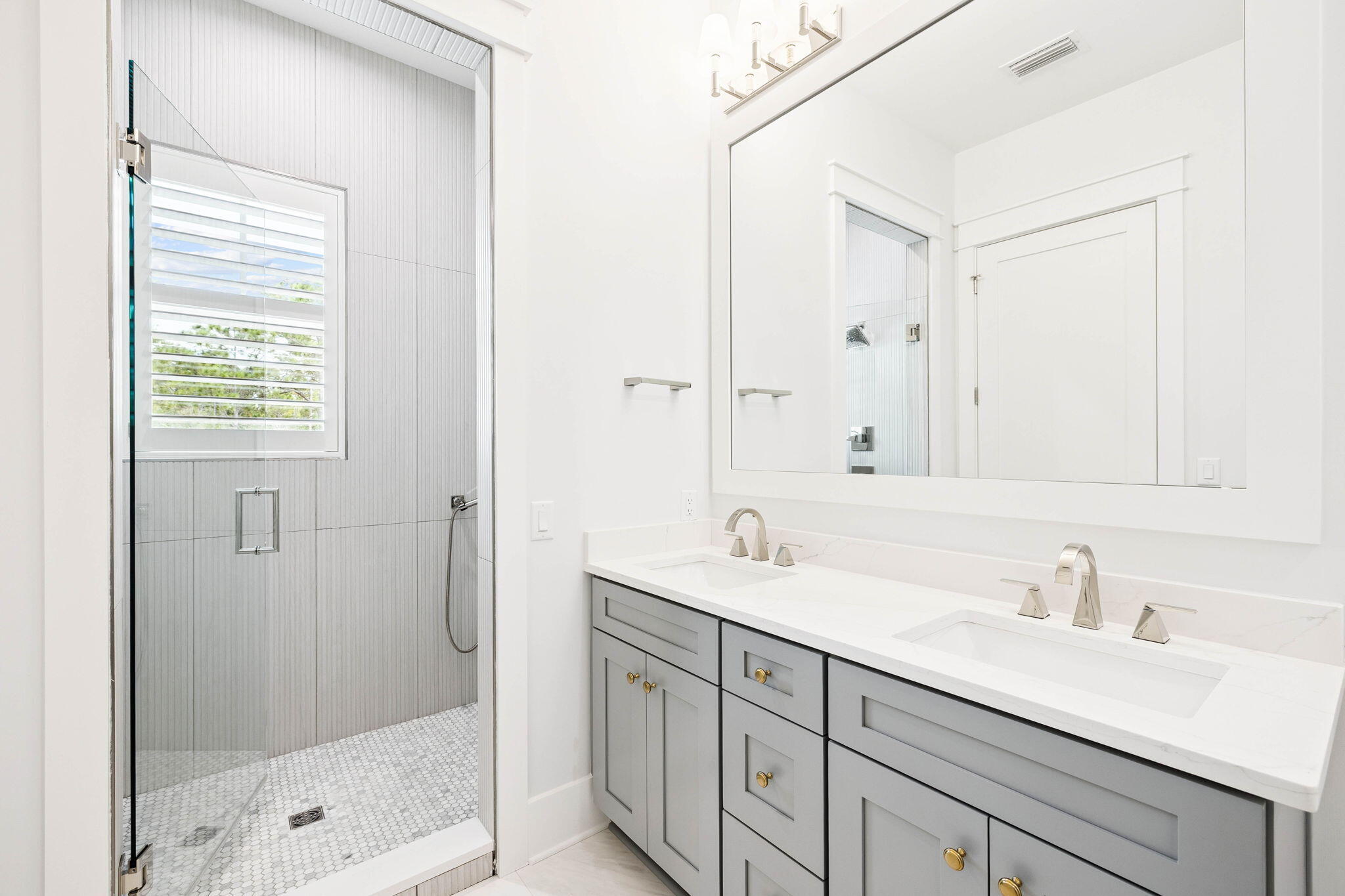 45 Grove Townhomes Place, Unit 105 Santa Rosa Beach, FL 32459 - Photo 19 of 36 a bathroom with a sink double vanity and shower