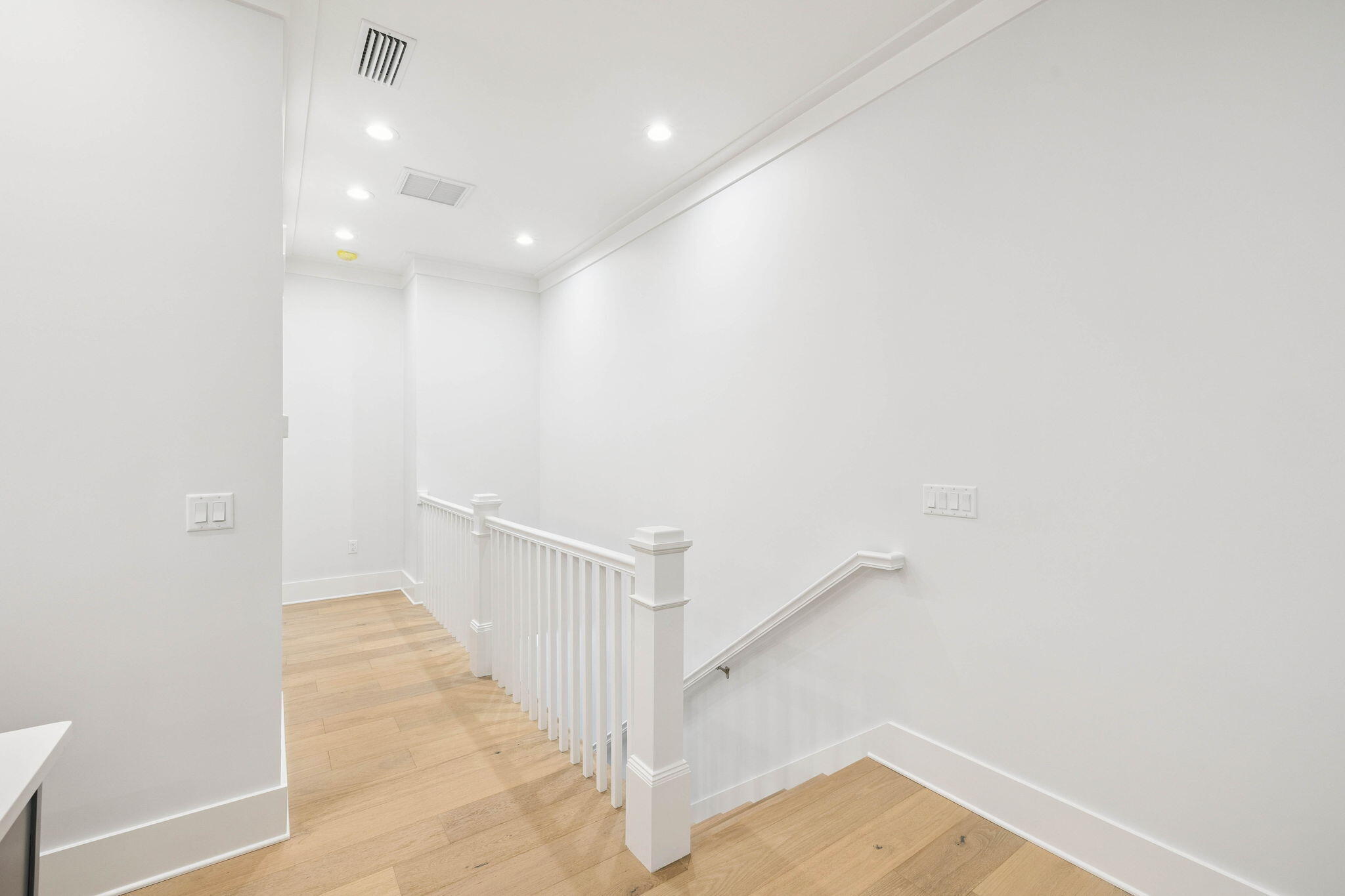 45 Grove Townhomes Place, Unit 105 Santa Rosa Beach, FL 32459 - Photo 24 of 36 a view of a hallway with staircase