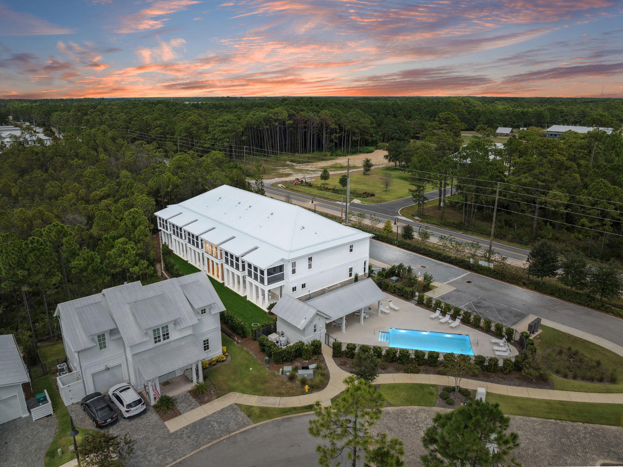 45 Grove Townhomes Place, Unit 105 Santa Rosa Beach, FL 32459 - Photo 4 of 36 a view of a balcony with two chairs and a table