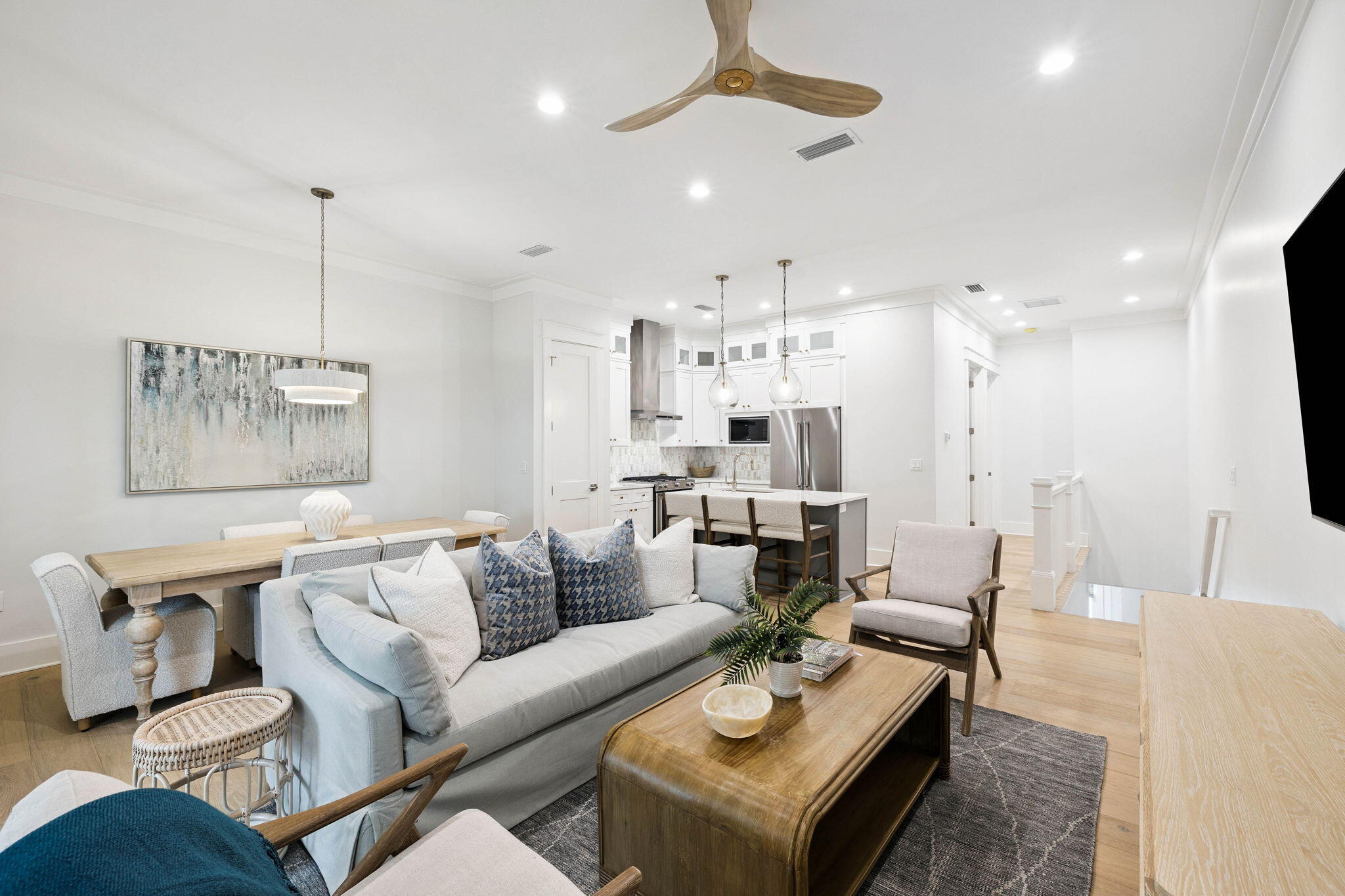 45 Grove Townhomes Place, Unit 105 Santa Rosa Beach, FL 32459 - Photo 8 of 36 a living room with furniture and a chandelier