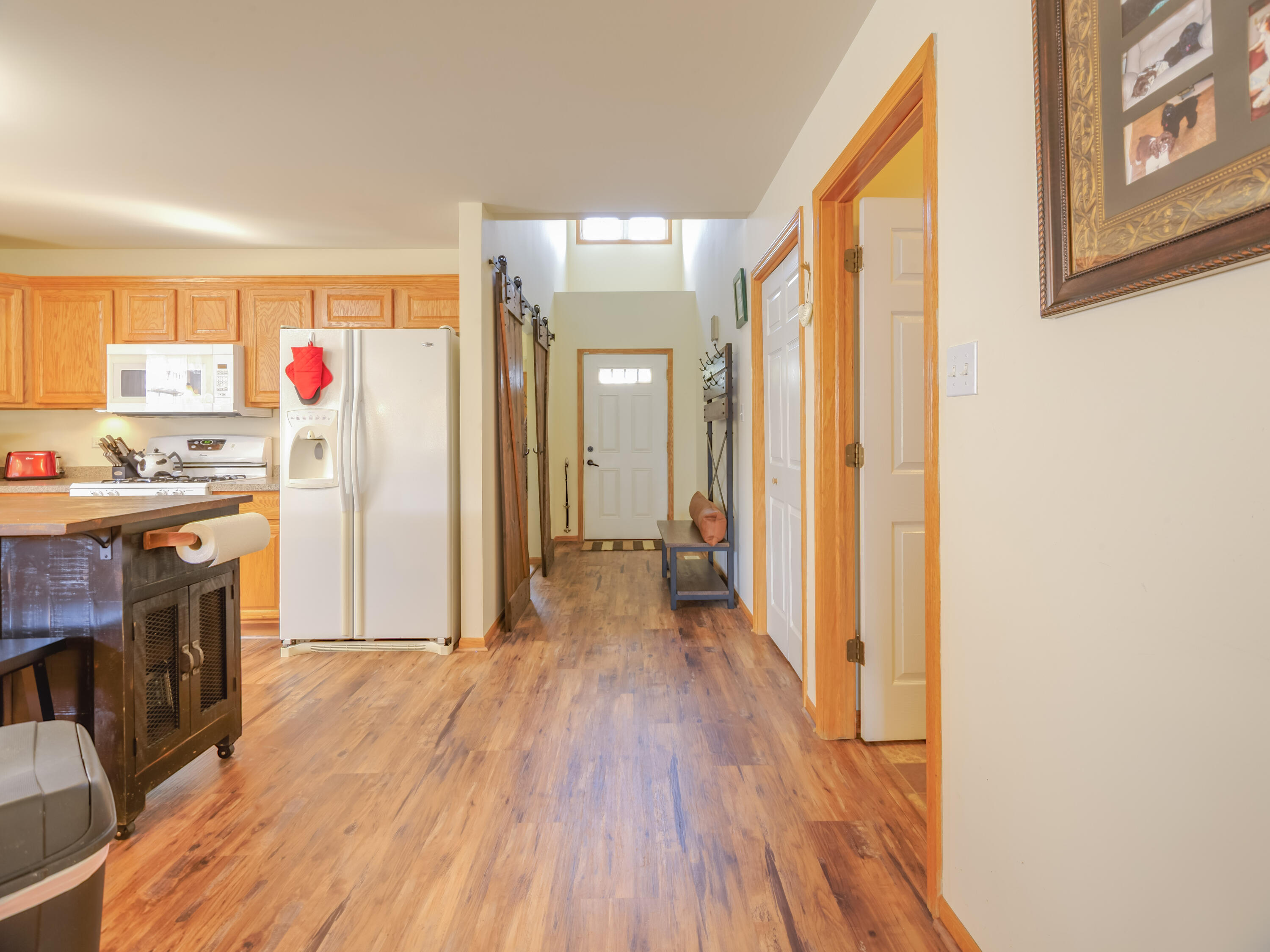 10123 Azalea Drive Crown Point, IN 46307 - Photo 13 of 32 a view of a livingroom with wooden floor and furniture