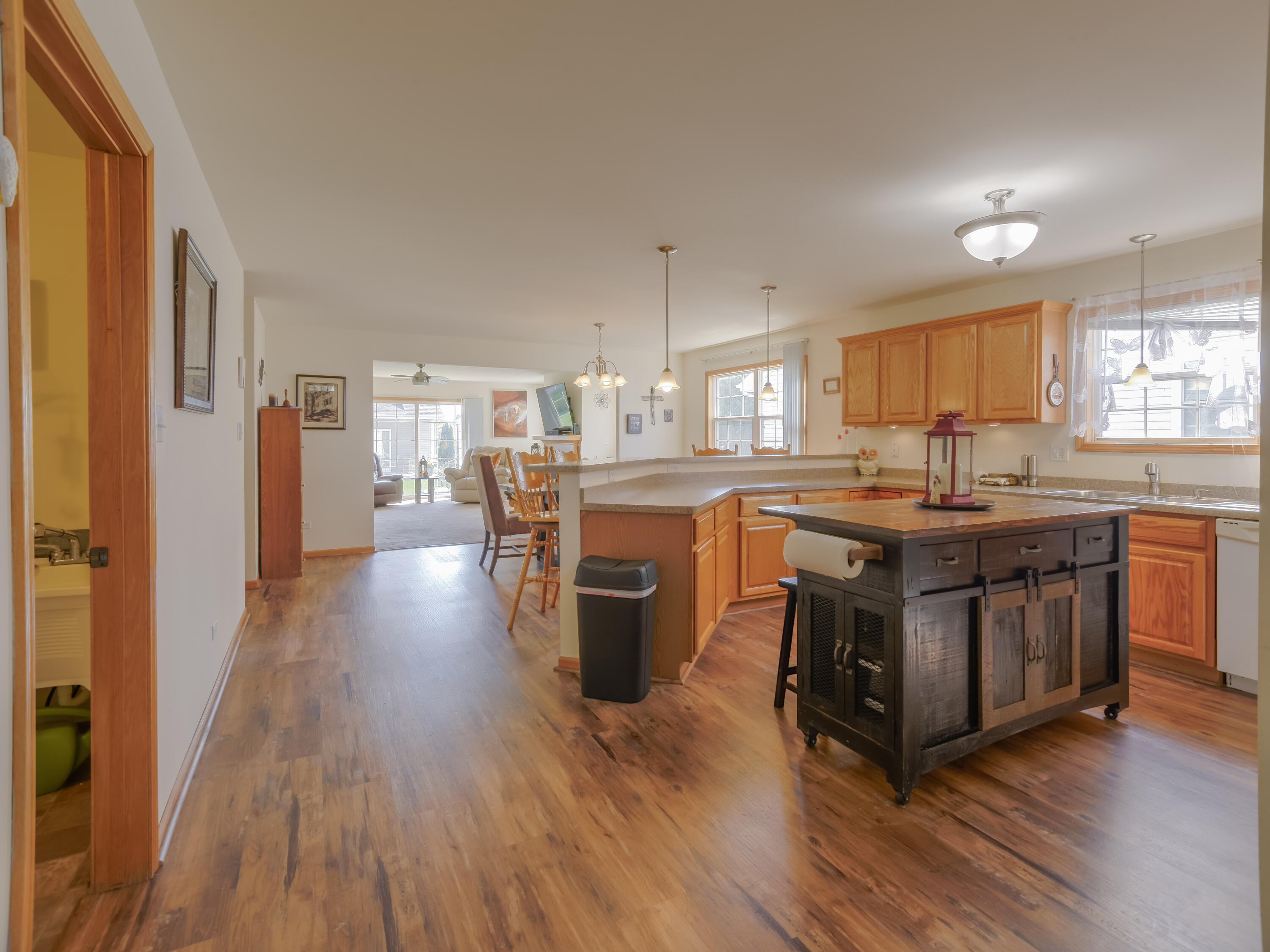 10123 Azalea Drive Crown Point, IN 46307 - Photo 16 of 32 a kitchen with lots of counter top space and wooden floor