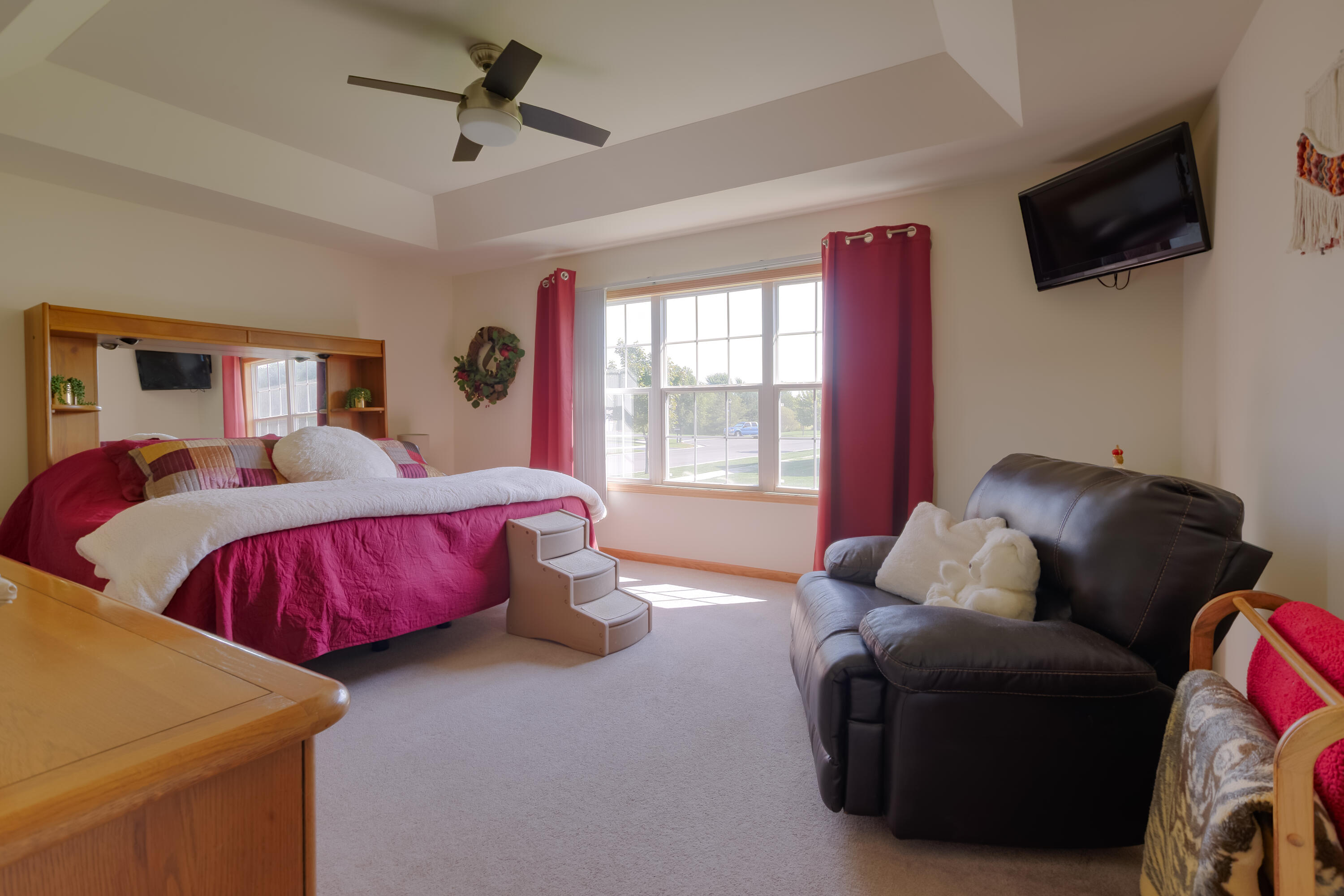 10123 Azalea Drive Crown Point, IN 46307 - Photo 20 of 32 a bedroom with a bed and flat screen tv