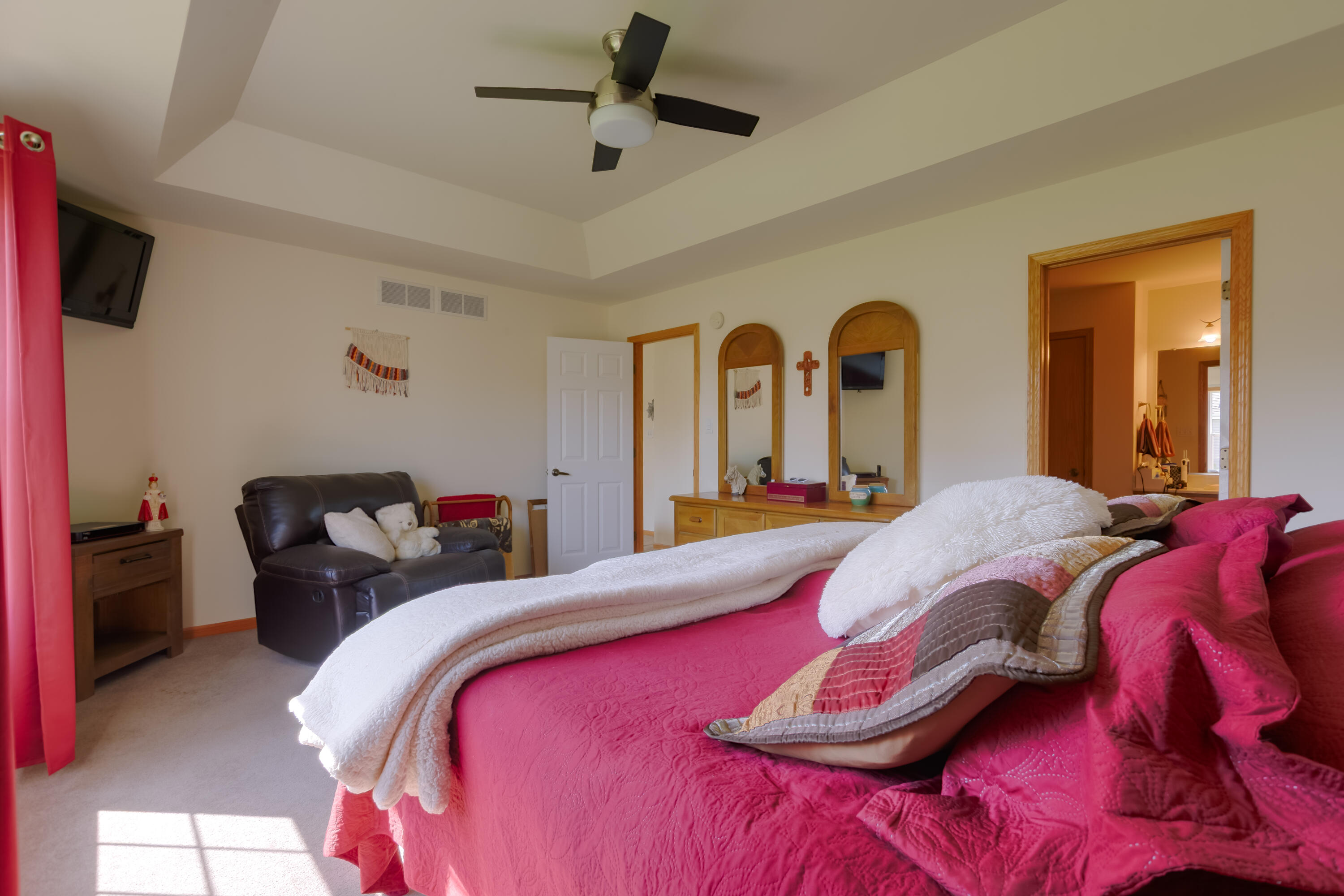 10123 Azalea Drive Crown Point, IN 46307 - Photo 21 of 32 a bedroom with a bed and a chandelier