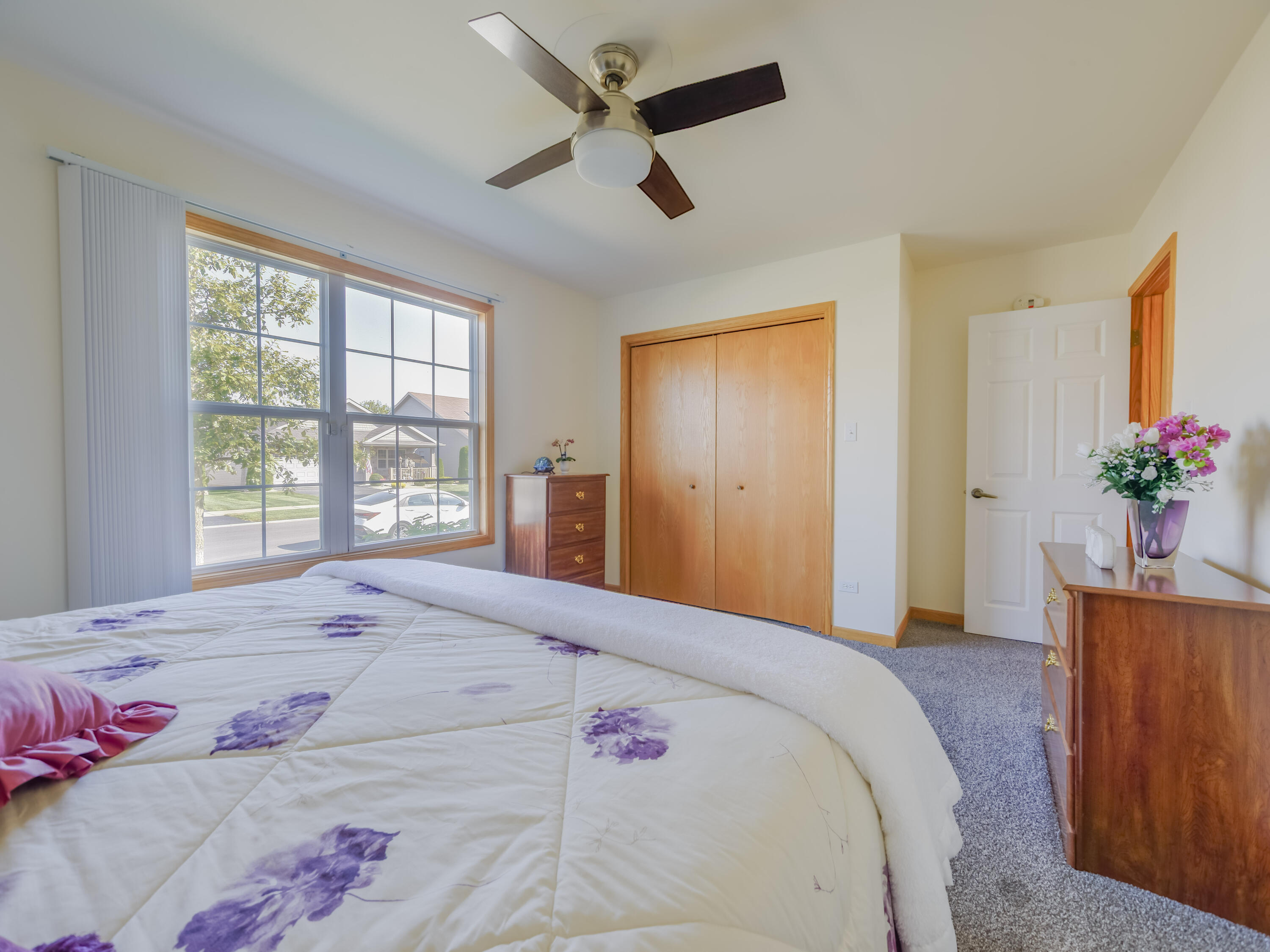 10123 Azalea Drive Crown Point, IN 46307 - Photo 28 of 32 a bedroom with a bed and a chandelier