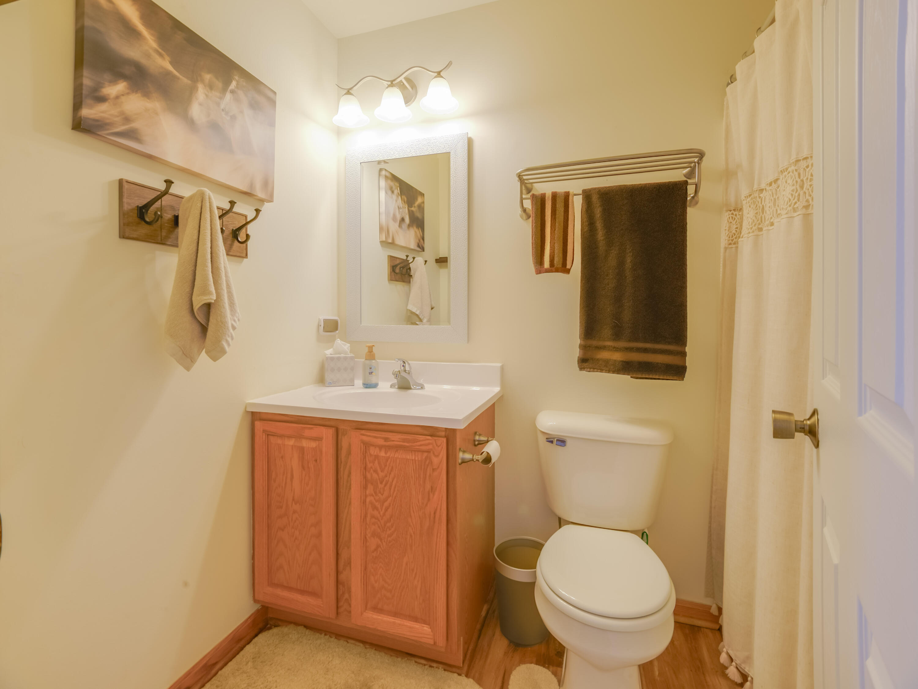 10123 Azalea Drive Crown Point, IN 46307 - Photo 29 of 32 a bathroom with a toilet sink and shower