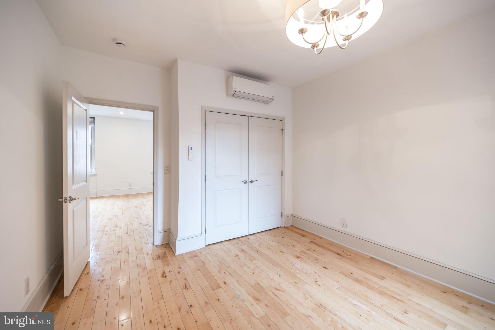 1310 Spruce Street, Unit 301 Philadelphia, PA 19107 - Photo 9 of 11 a view of empty room with wooden floor
