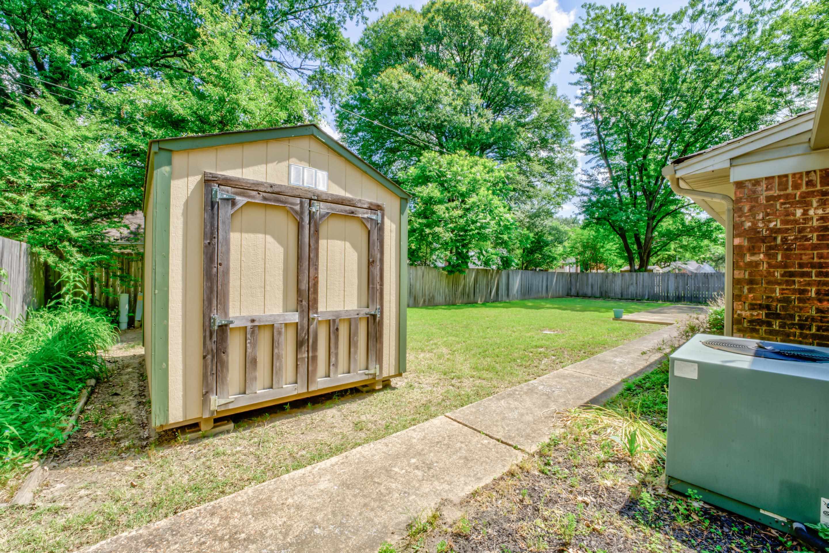 5868 Ridgevale Road Memphis, TN 38119 - Photo 22 of 24 a house with trees in the background