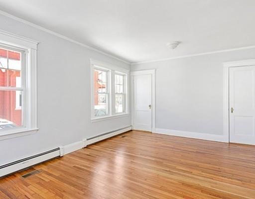 27 Elsworth Road Newton, MA 02465 - Photo 11 of 14 an empty room with wooden floor and windows
