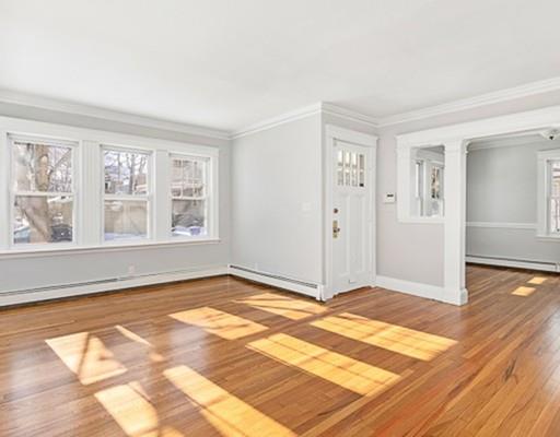27 Elsworth Road Newton, MA 02465 - Photo 2 of 14 a view of an empty room with wooden floor and a window