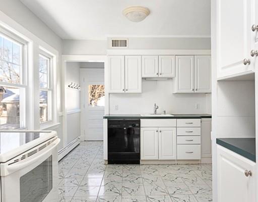 27 Elsworth Road Newton, MA 02465 - Photo 5 of 14 a kitchen with granite countertop a sink cabinets and stainless steel appliances
