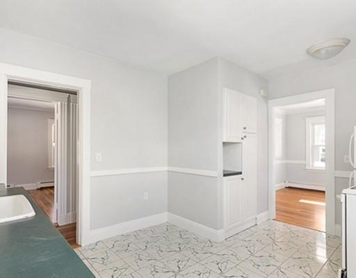 27 Elsworth Road Newton, MA 02465 - Photo 6 of 14 a view of a bathroom with a tub and shower