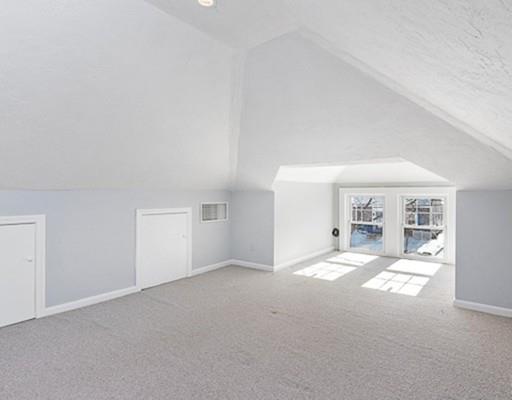 27 Elsworth Road Newton, MA 02465 - Photo 8 of 14 a view of a livingroom with a fireplace