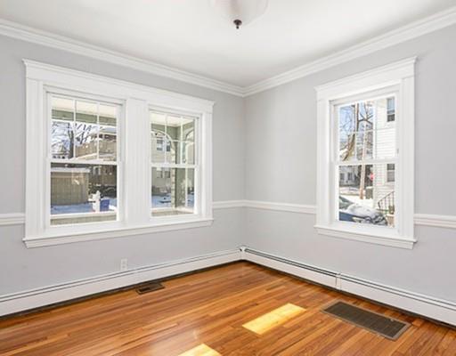 27 Elsworth Road Newton, MA 02465 - Photo 9 of 14 a view of an empty room with wooden floor and a window