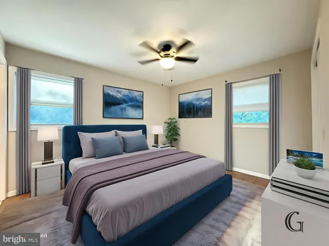 a bedroom with bed and a chandelier