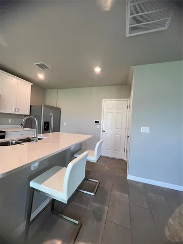 a room with a projector and screen