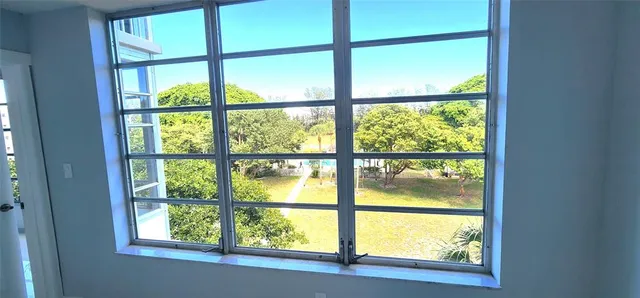 a view of an empty room with a window
