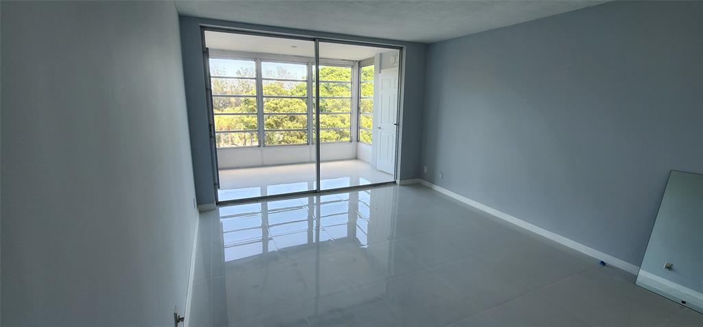 2650 South Course Drive, Unit 505 Pompano Beach, FL 33069 - Photo 16 of 42 a view of an empty room with a window