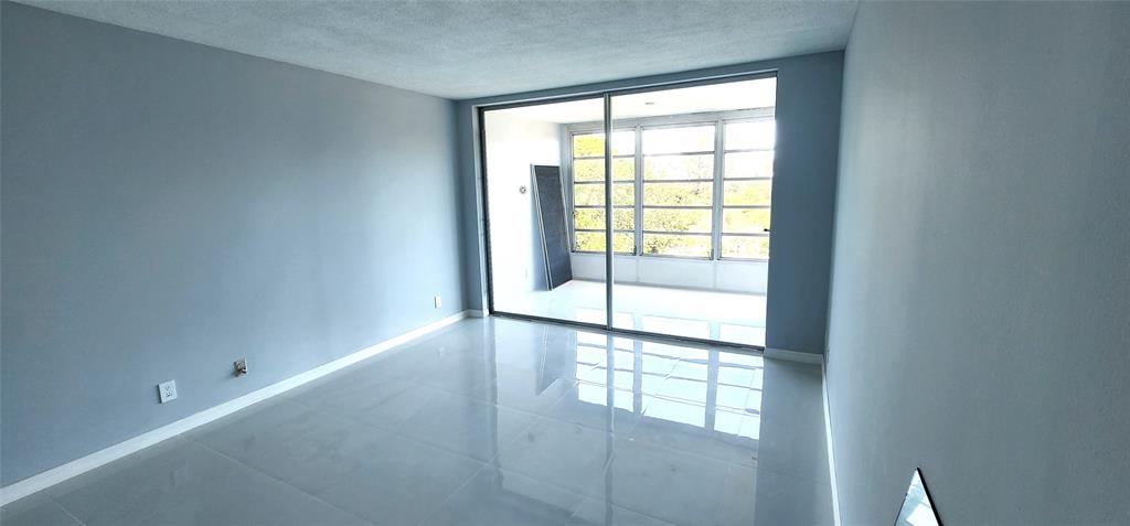 2650 South Course Drive, Unit 505 Pompano Beach, FL 33069 - Photo 17 of 42 an empty room with windows and view of an empty room