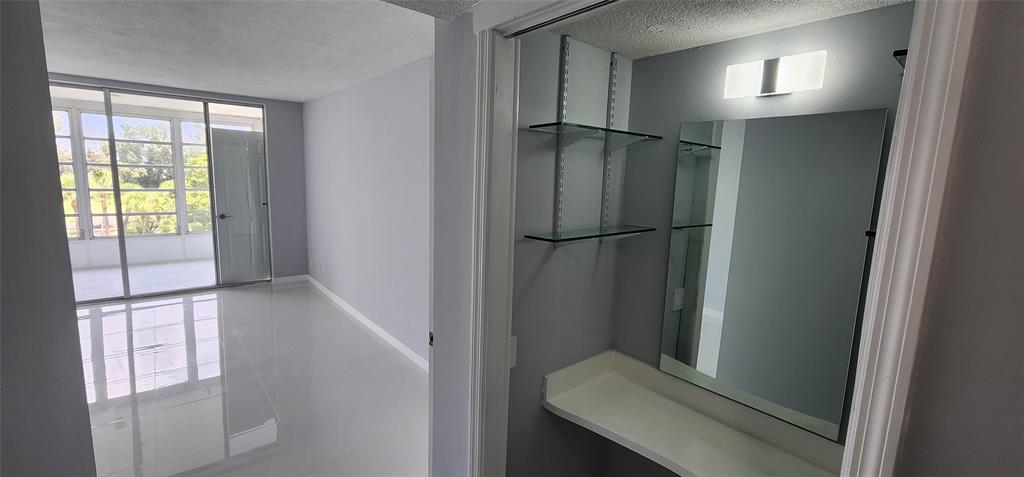 2650 South Course Drive, Unit 505 Pompano Beach, FL 33069 - Photo 22 of 42 a view of entryway with wooden floor