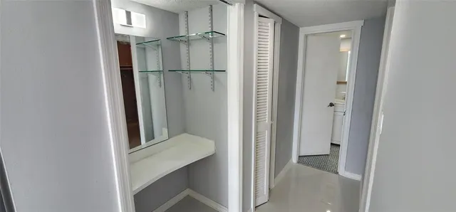 a view of an empty room and closet