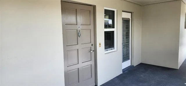 a view of swimming pool with a patio and a garden