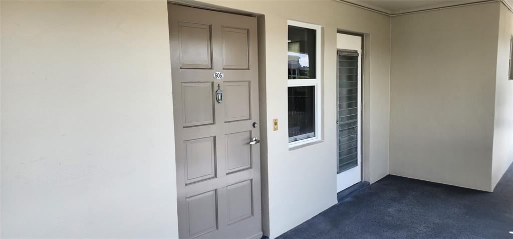 2650 South Course Drive, Unit 505 Pompano Beach, FL 33069 - Photo 29 of 42 a view of entryway and kitchen