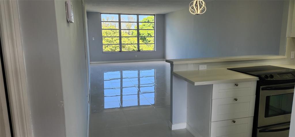 2650 South Course Drive, Unit 505 Pompano Beach, FL 33069 - Photo 3 of 42 a view of an entryway with a window