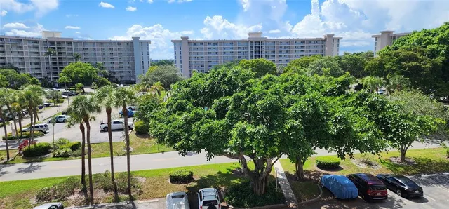 a view of a building with a yard
