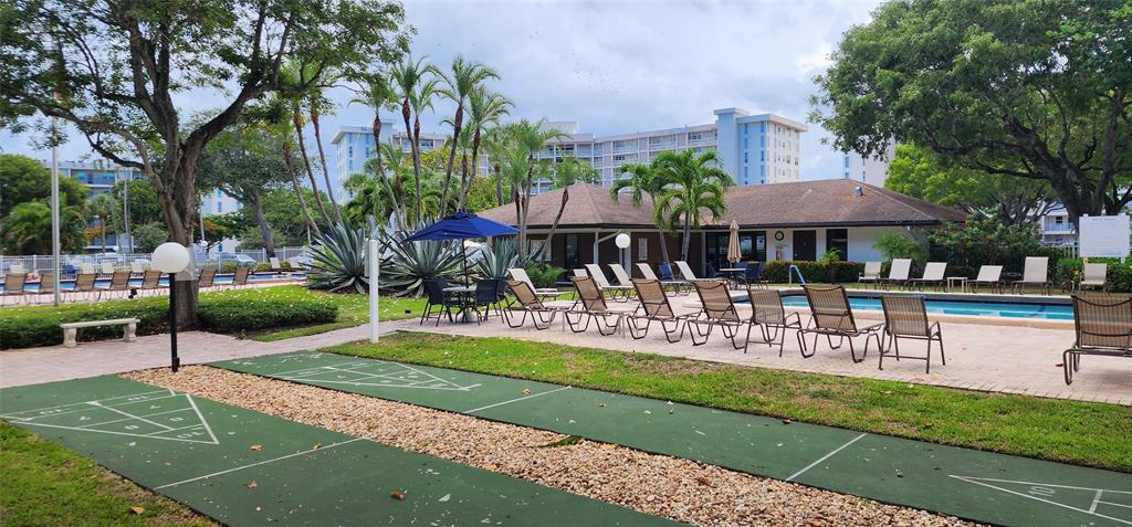 2650 South Course Drive, Unit 505 Pompano Beach, FL 33069 - Photo 38 of 42 a view of a building with a yard