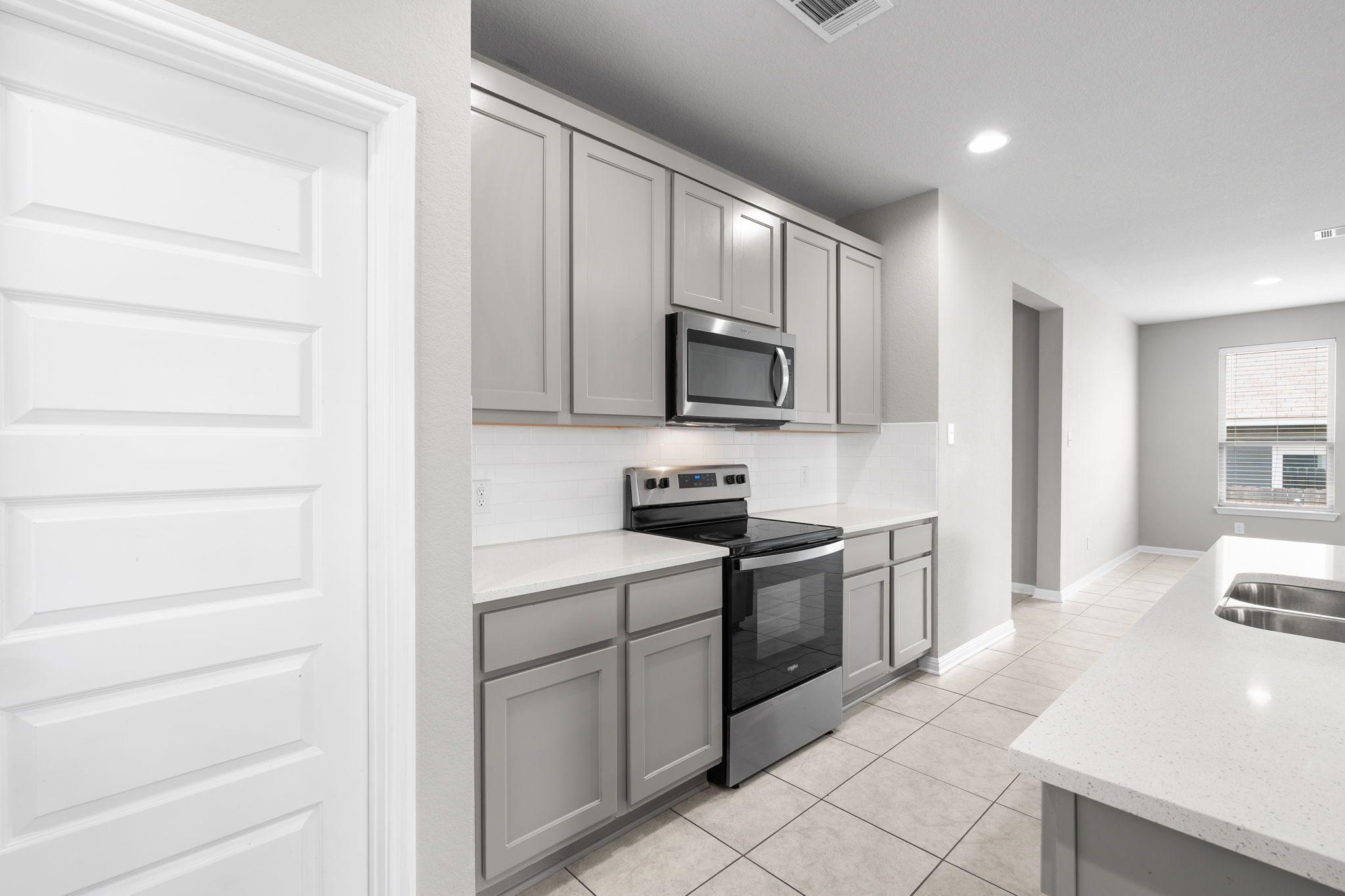313 Mclintock Road Jarrell, TX 76537 - Photo 17 of 40 Modern kitchen with sleek cabinetry and essential appliances for everyday living.