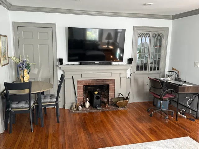 a living room with furniture fireplace and flat screen tv