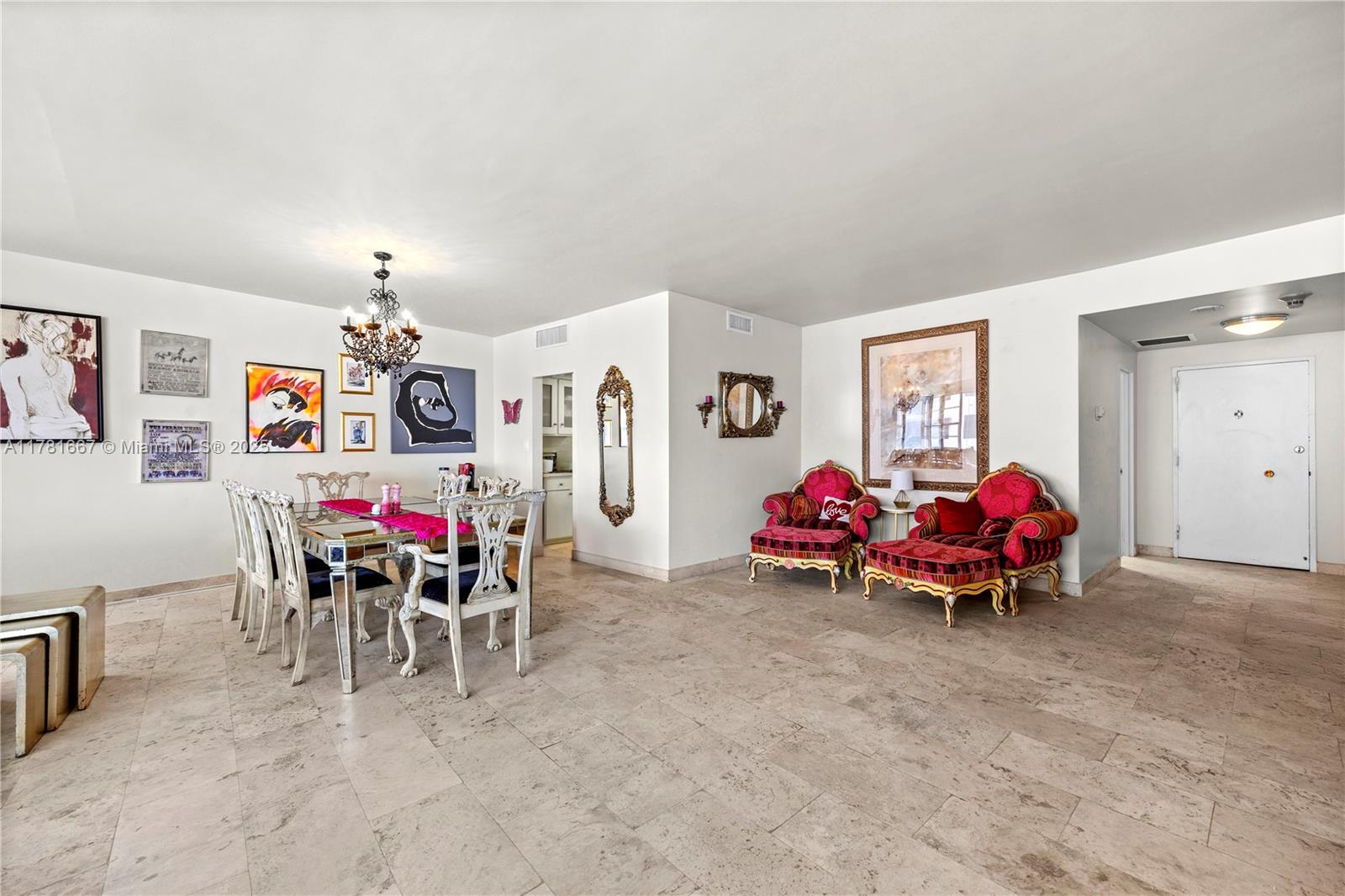 5255 Collins Avenue, Unit 11A Miami Beach, FL 33140 - Photo 2 of 15 a living room with furniture and white walls