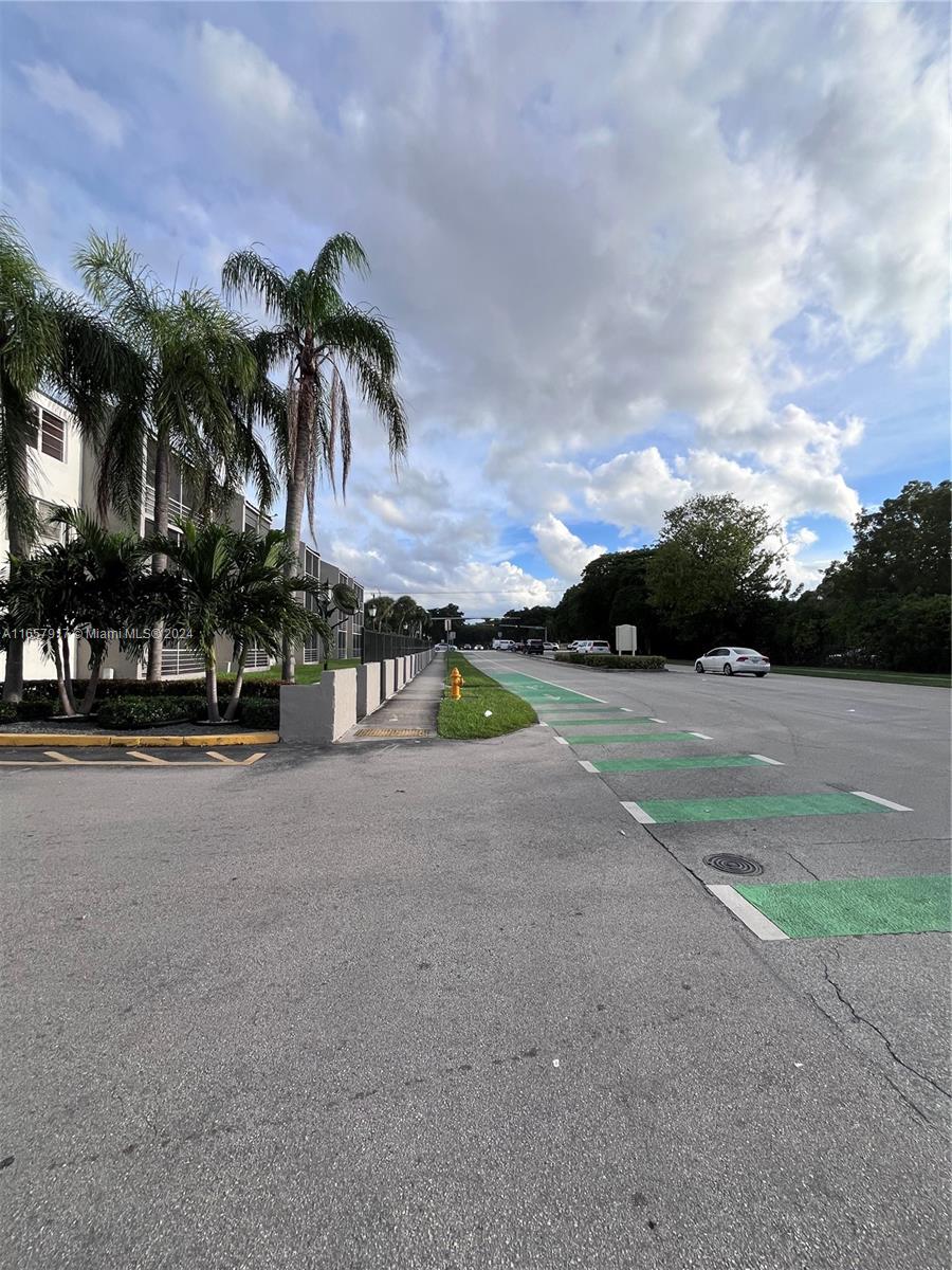 14165 Southwest 87th Street, Unit D404 Miami, FL 33183 - Photo 14 of 25 entrance from 142 ave