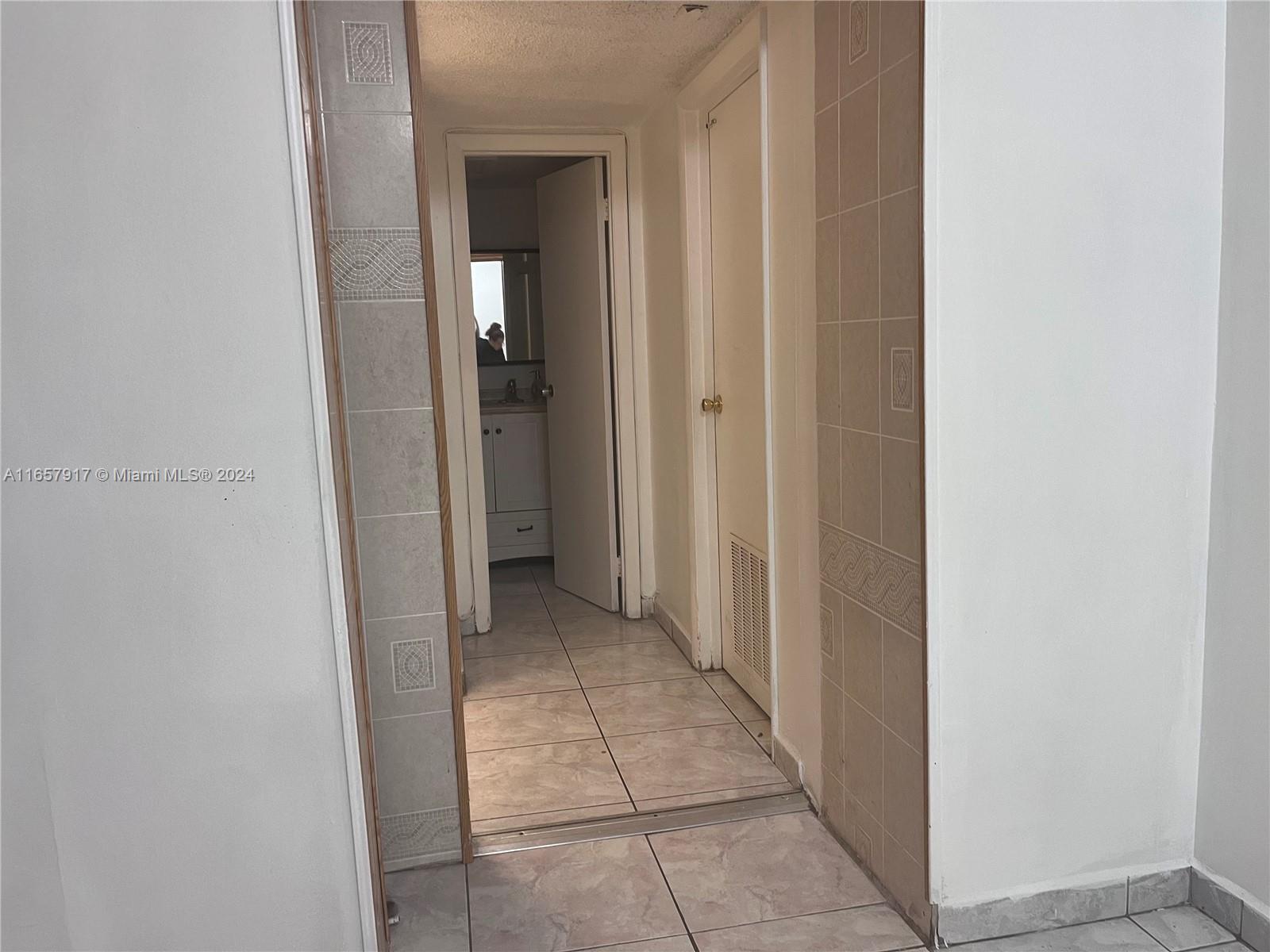 14165 Southwest 87th Street, Unit D404 Miami, FL 33183 - Photo 8 of 25 hallway