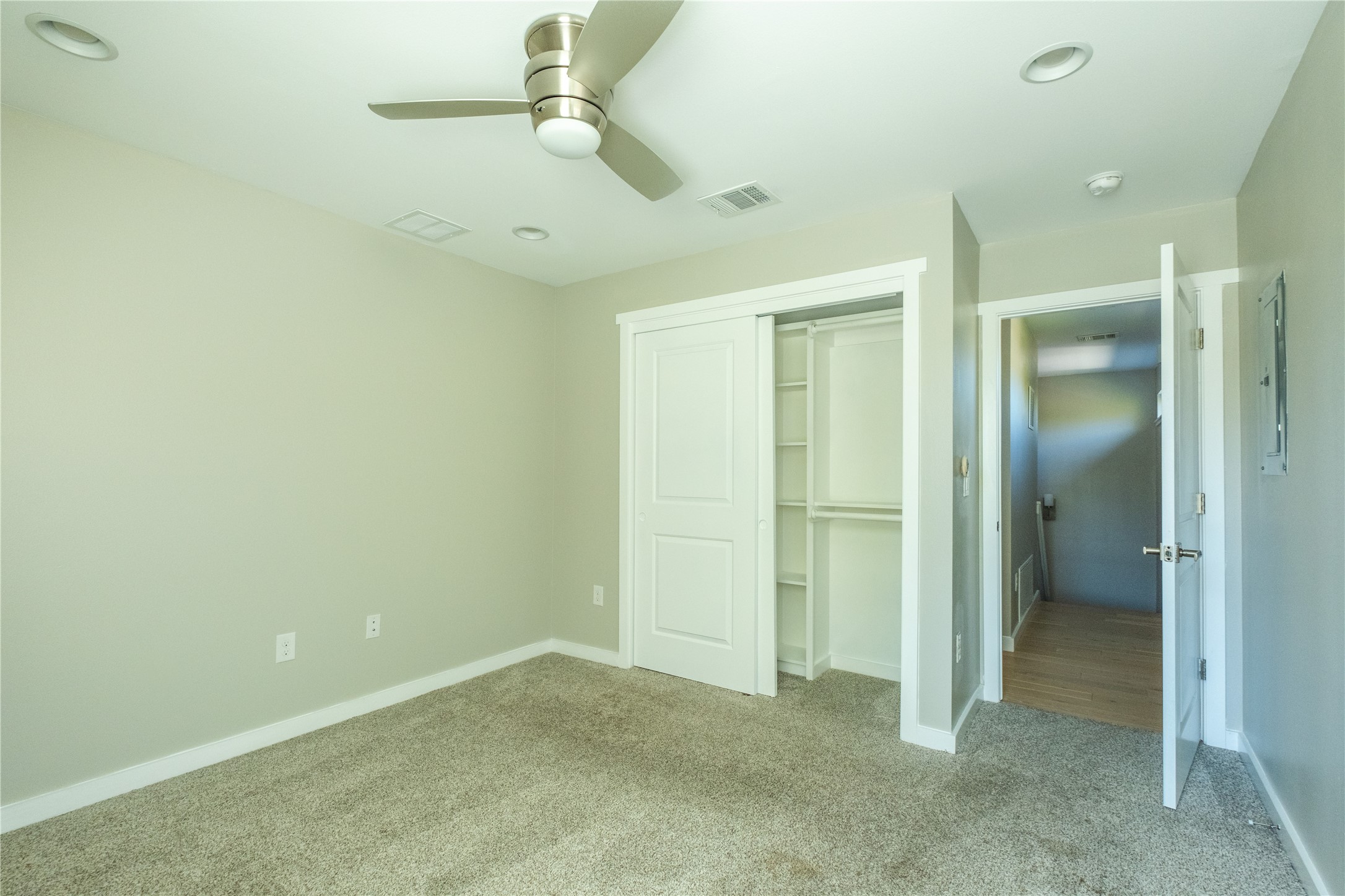 7601 Bethune Avenue, Unit B Austin, TX 78752 - Photo 19 of 39 Unfurnished bedroom featuring carpet, ceiling fan, and a closet