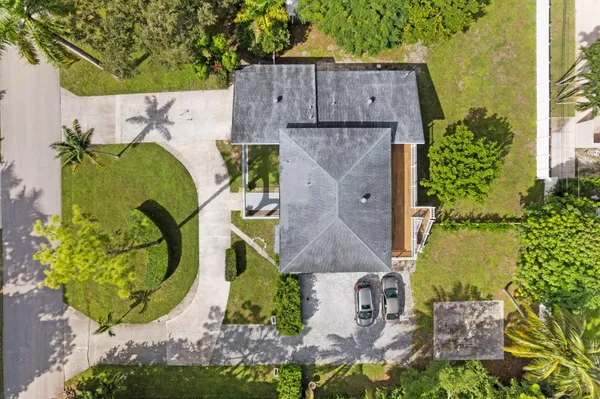 an aerial view of a house with a swimming pool