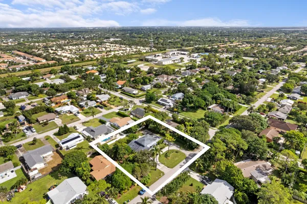 an aerial view of residential houses with outdoor space