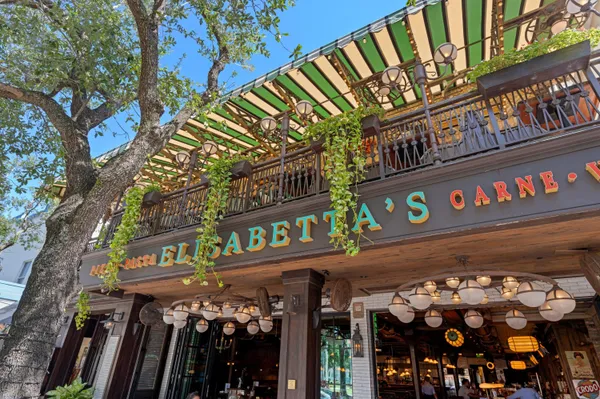 an outdoor sitting area with chairs
