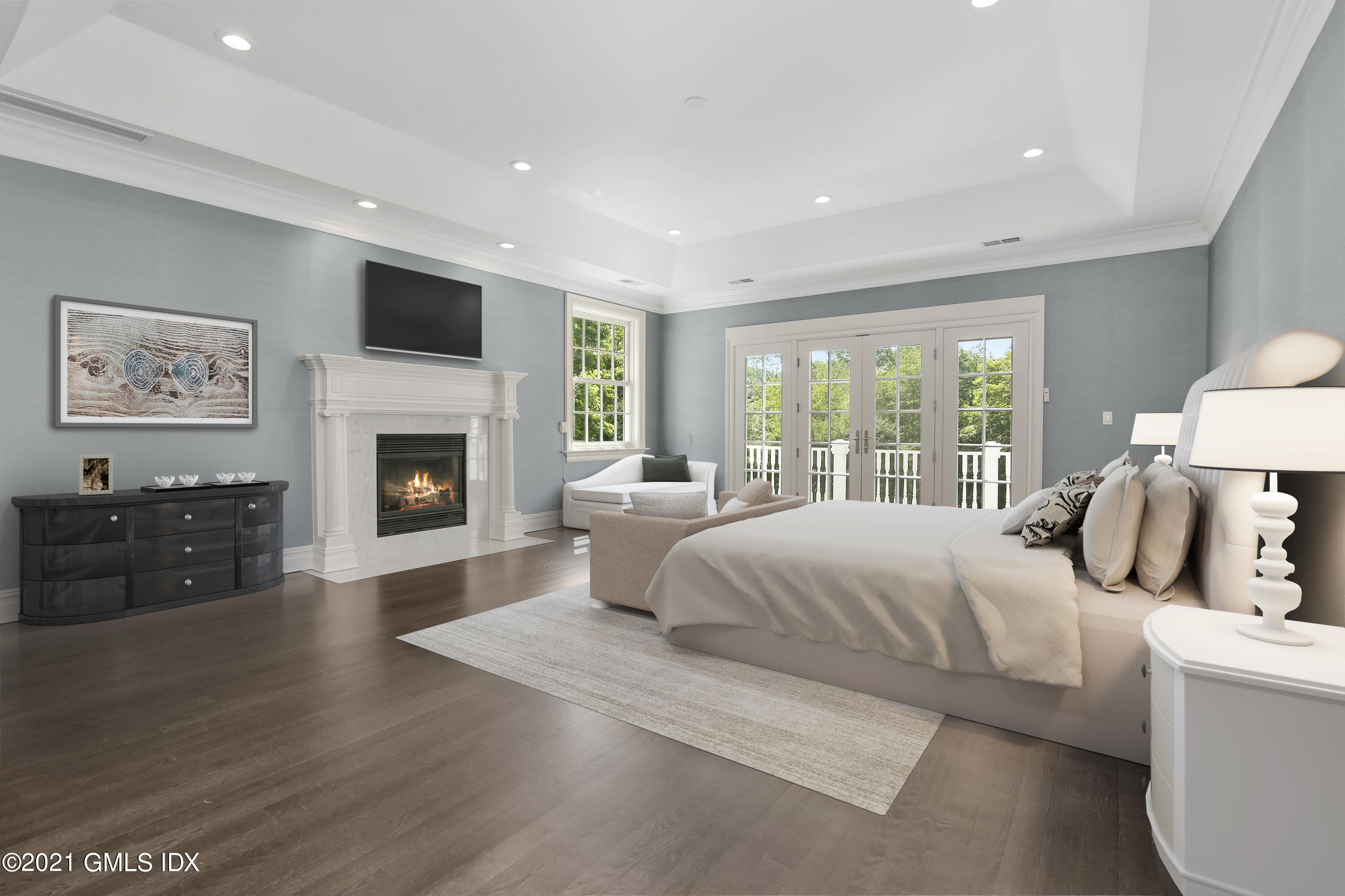 245 Bedford Road Greenwich, CT 06831 - Photo 16 of 27 a bedroom with a large bed and a fireplace