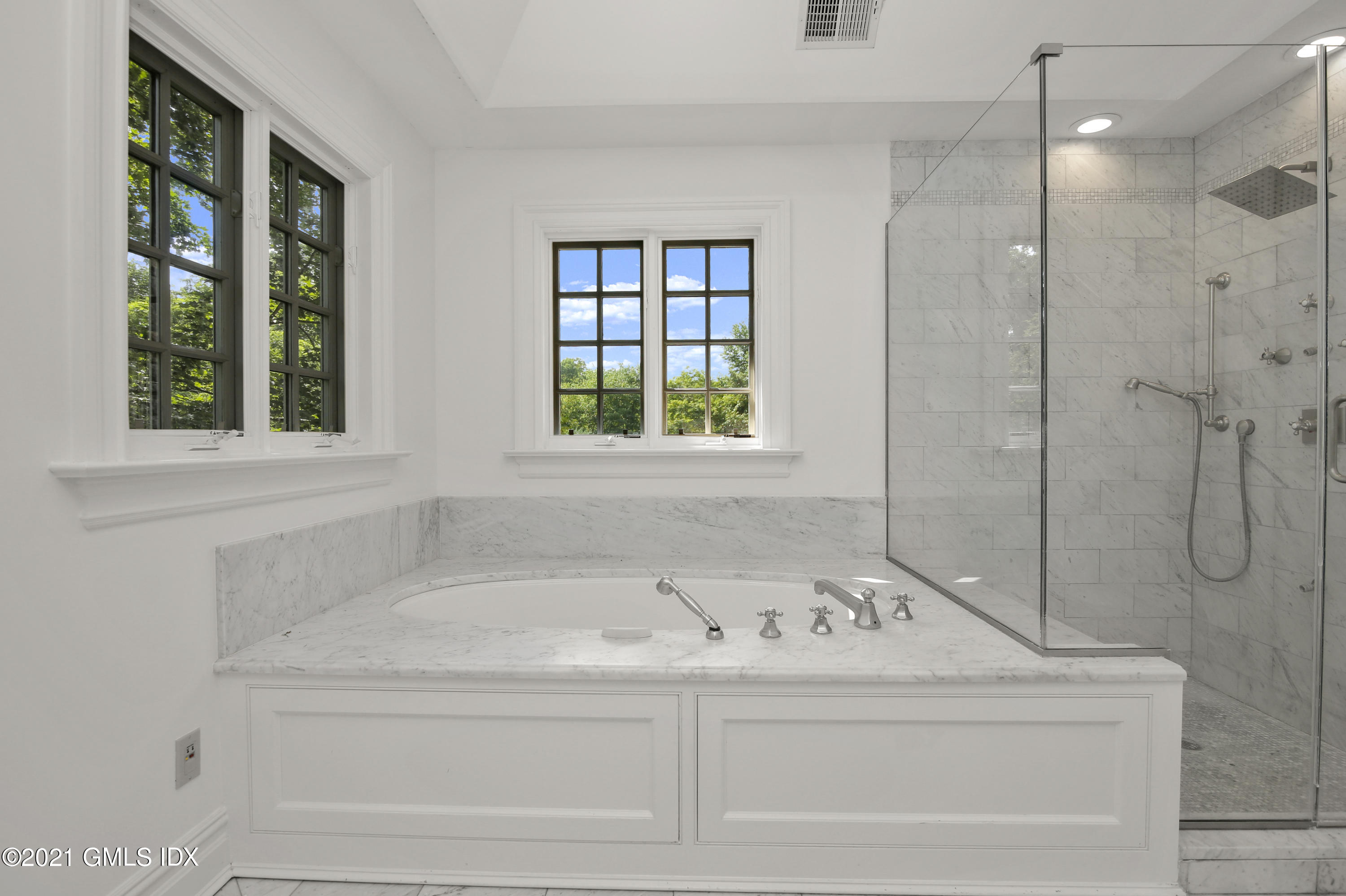 245 Bedford Road Greenwich, CT 06831 - Photo 18 of 27 a bathroom with a bathtub and window