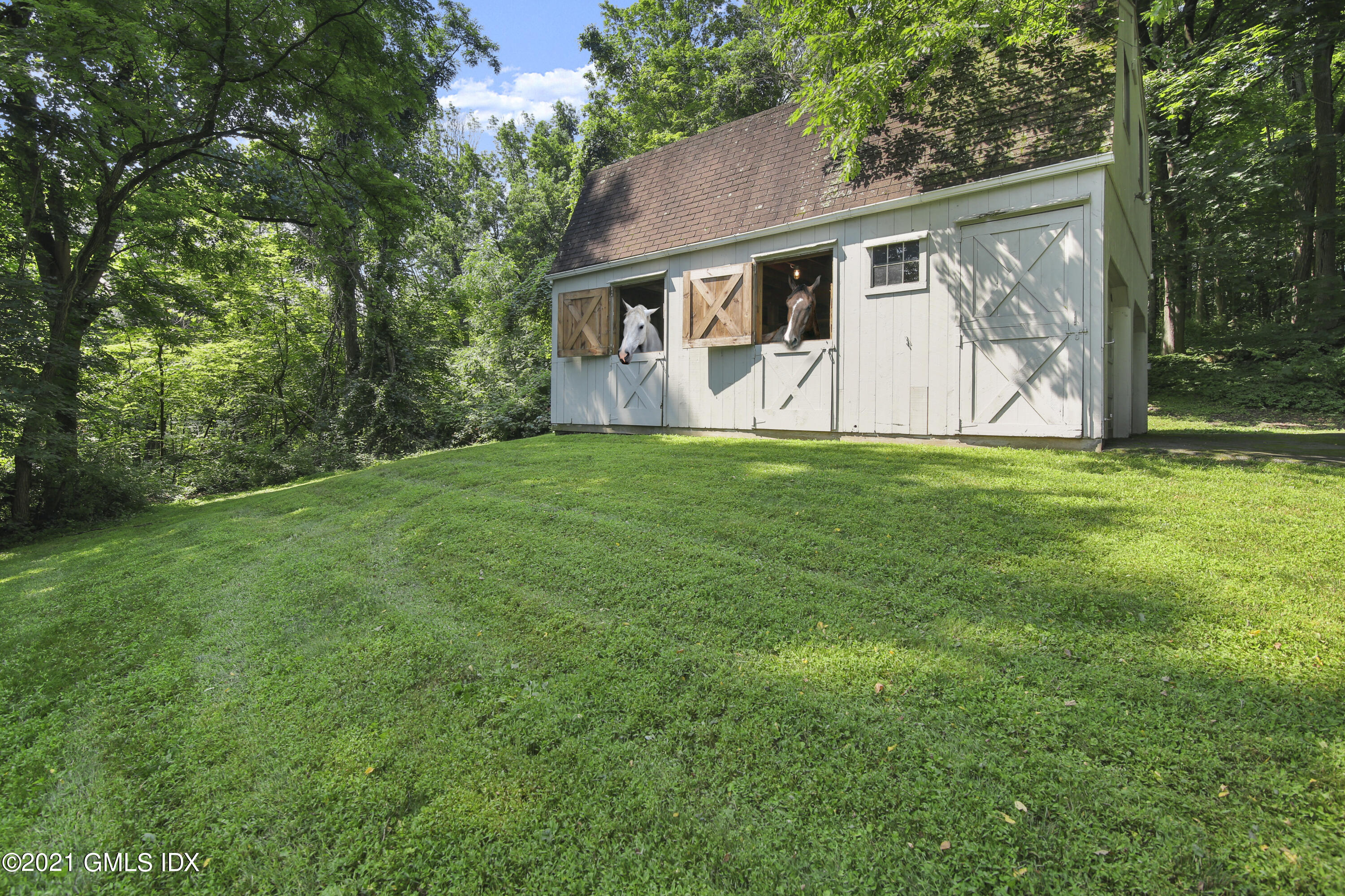 245 Bedford Road Greenwich, CT 06831 - Photo 22 of 27 a view of a house with backyard