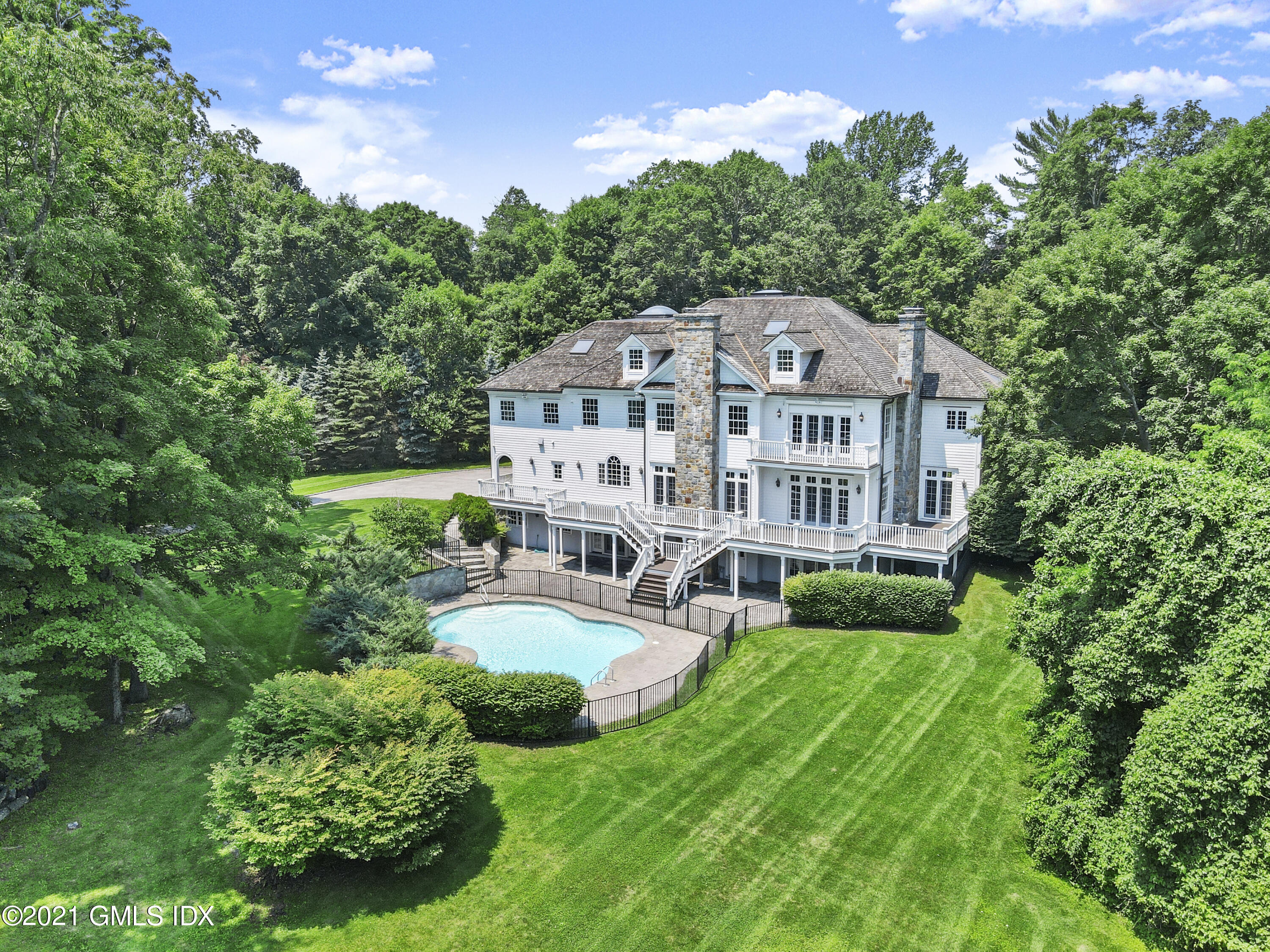 245 Bedford Road Greenwich, CT 06831 - Photo 27 of 27 a view of a house with a big yard plants and large trees