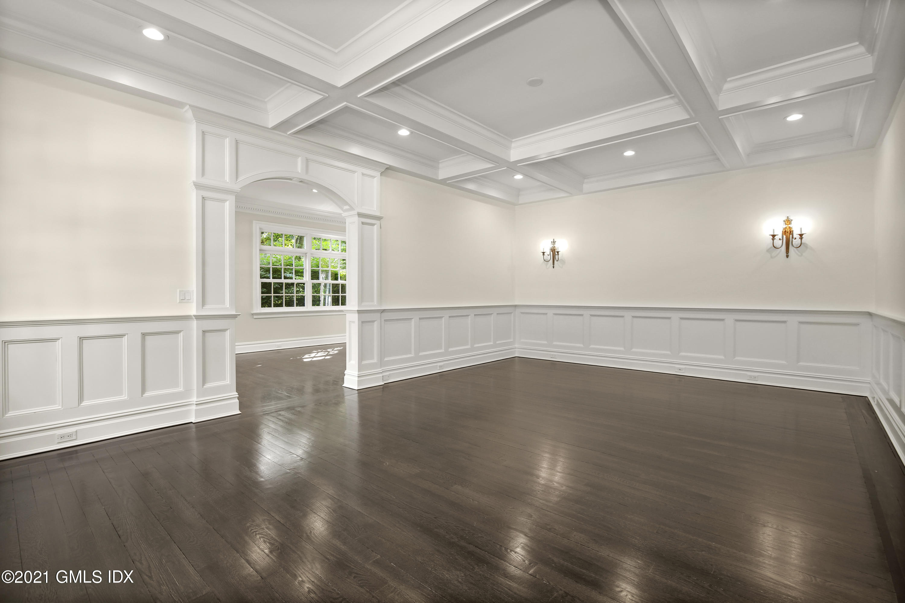 245 Bedford Road Greenwich, CT 06831 - Photo 5 of 27 an empty room with wooden floor and windows